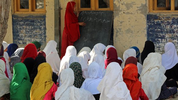 Afghan girls attend class at a primary school in Bati Kot district, Nangarhar province, September 18. [Shafiullah Kakar/AFP]