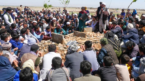 Afghans mourn at a burial ceremony after a gunman attacked a mosque in Guzara district, Herat province, on April 30. ISIS-K claimed responsibility for the attack, which killed six people. [Mohsen Karimi/AFP]