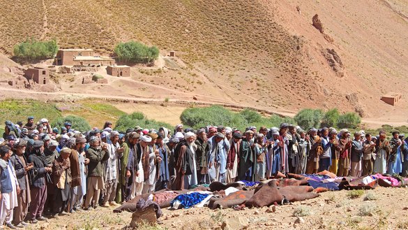 Afghan Shia offer funeral prayers September 13, a day after ISIS-K gunmen killed at least 14 civilians and wounded six others in Sang‐e‐Takht district, Daikundi province. [AFP]