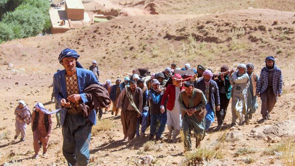 Afghan Shia mourners carry the deceased for funeral prayers on September 13, a day after ISIS-K gunmen killed civilians in Sang‐e‐Takht district, Daikundi province. [AFP]