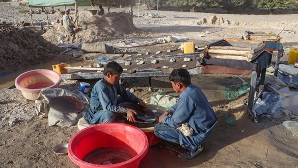 Workers pan for gold using traditional methods along the Kokcha River in Badakhshan province, Afghanistan, last September 12. [Omer Abrar/AFP]