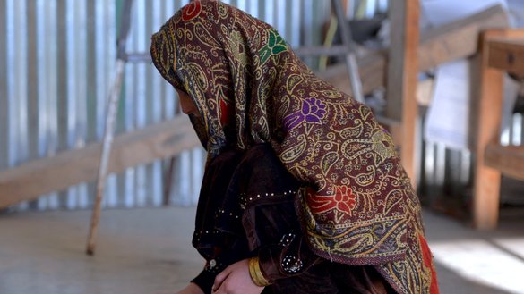 A young Pakistani girl who escaped a forced marriage, plays a local game in the Madyan Valley of Swat in northwestern Pakistan. [Aamir Qureshi/AFP]